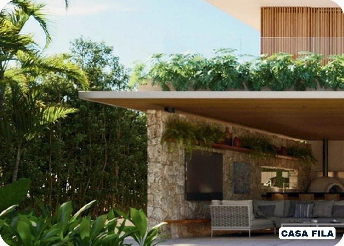 Varanda da Casa Fila com laje de cobertura verde, parede de pedra e mata ao redor