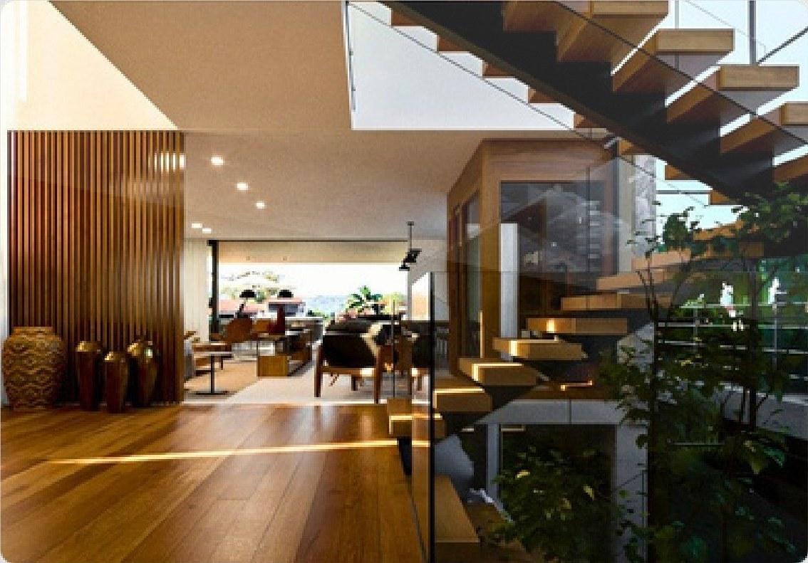 Escada suspensa de madeira com painel ripado e sala integrada ao jardim